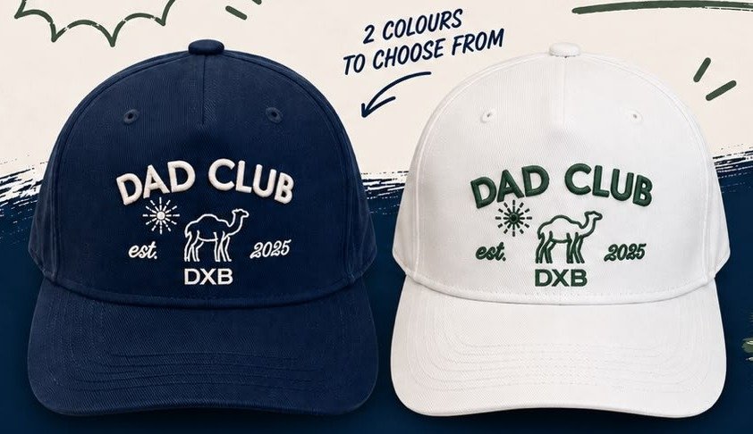 Dad Club DXB caps in navy and white with an embroidered camel crest